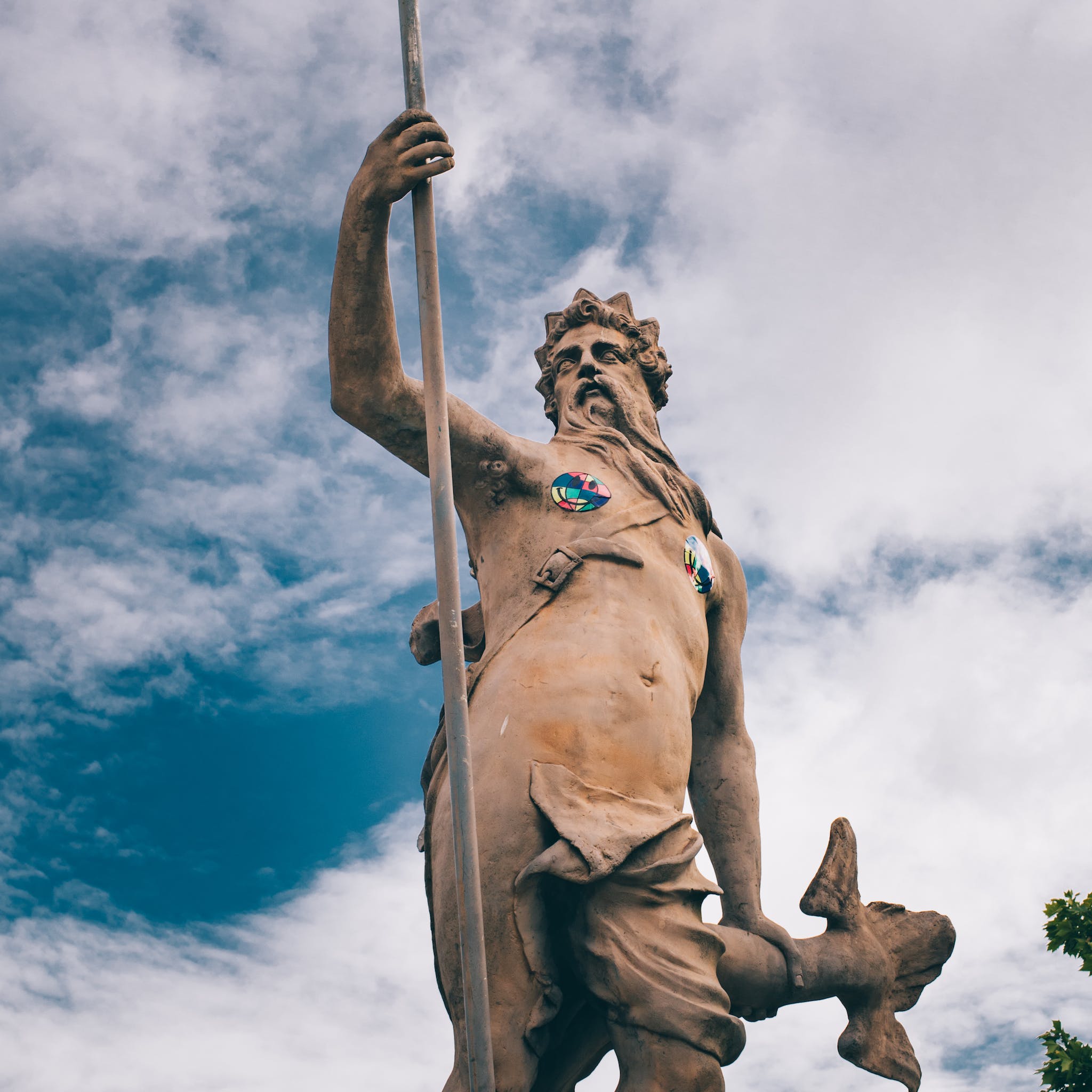 Statue of Neptune against blue sky